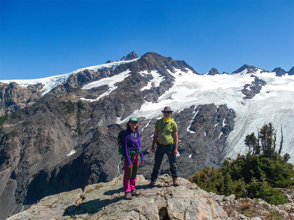 Anna Ledeczi and Harold Tobin pose on an outcrop in front of White Glacier.